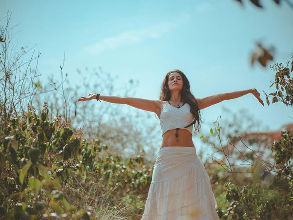 Person stretching gently in a calm, focused environment.